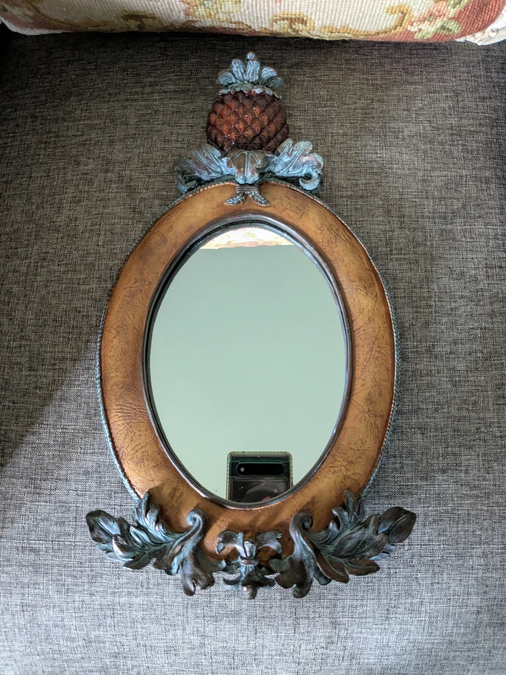 Ornate Brown And Aged Teal Oval Wall Mirror with Pineapple Finial